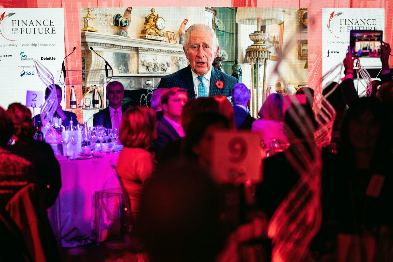 People watching video message from HRH The Prince of Wales