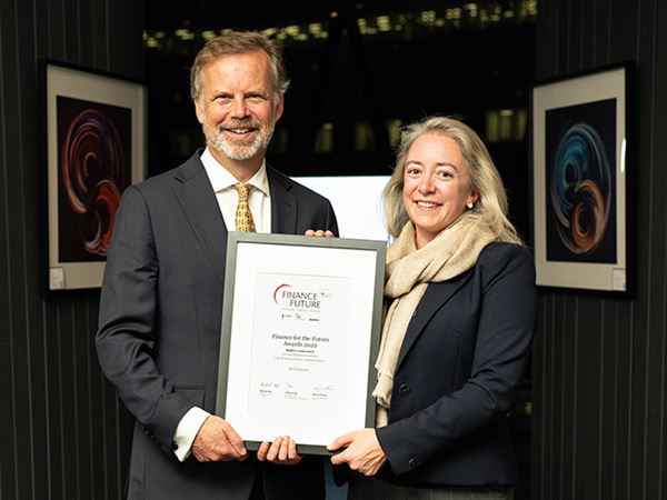 Representatives from ETF Partners holding their award certificate.