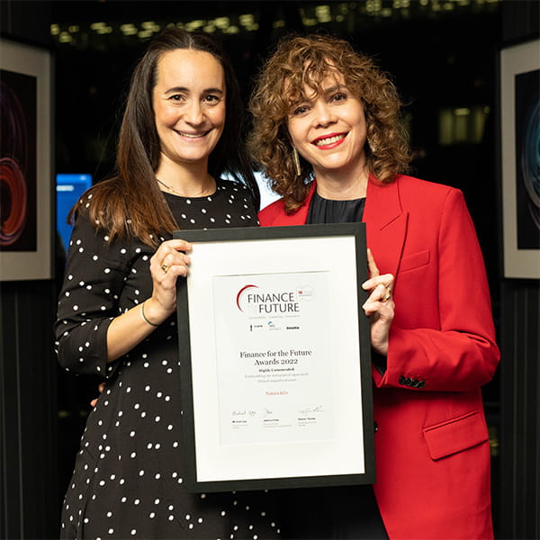 Natura & Co holding their award certificate